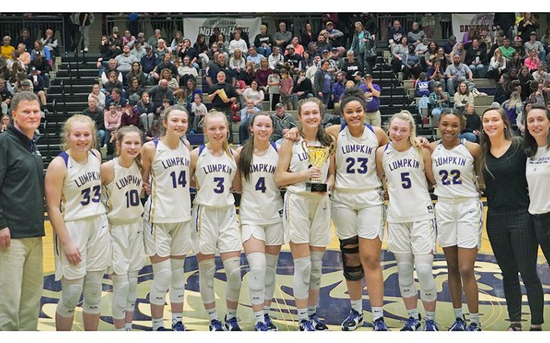 The Lumpkin County High School Girls Basketball team win the Region Championship trophy for the second-straight year.