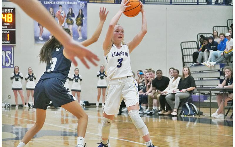 Ciera Brooks looks to feed the ball to an open teammate during Lumpkin’s win over White County.