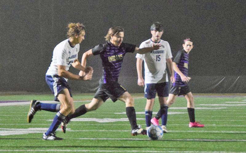 Senior Ethan Layne pushes the ball forward on the attack during the Indians’ win over White County on Friday. (Photos courtesy of Esteban Ramirez)