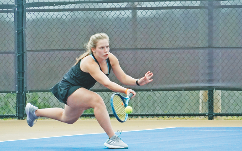 Cady Geddings lunges forward to return a volley during Lumpkin’s 7 AAA Region Tournament. Geddings won the final match of the tournament for the Indians to clinch a third place finish in the region.