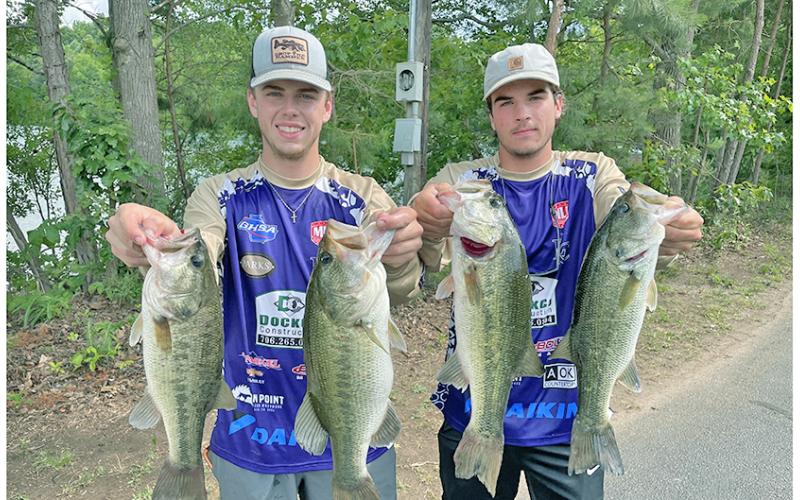 A.J. Moss (left) and Carder Dockery show off their catches for the weekend as the duo competed in the B.A.S.S. Nation Georgia High School State Championship last Friday and Saturday on Lake Hartwell. The team earned 13th place with their five fish weighing in at 25.19 lbs.