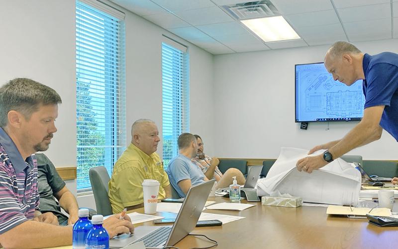 Lumpkin County Commissioners discuss the latest blueprint for the proposed county pool at last week’s BOC meeting.