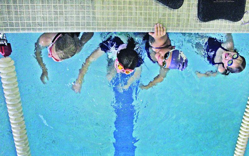 The Lumpkin County Parks and Rec Swim team is preparing to send 19 swimmers to compete at the GRPA State meet in Tifton this weekend. Pictured (from left): Lily Weber, Abagail Herrit, McKenzie Wiggington and Elsie Grizzle.