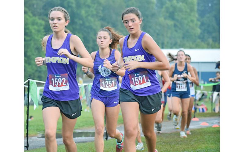 Keli George, left, and Alexis Daughtery turned in a gutty performance on the rain soaked course in Pickens County over the weekend.