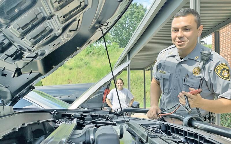 Officer Ceszar Ramos was ready with the jumper cables on Monday morning when Madison Pruitt's car unexpectedly died out in the Lumpkin County Sheriff's Office parking lot. That's all part of the job for LCSO deputies.