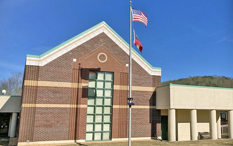 City Hall staff received an unexpected visit from a murder suspect on Friday who reportedly said he had a confession to make.