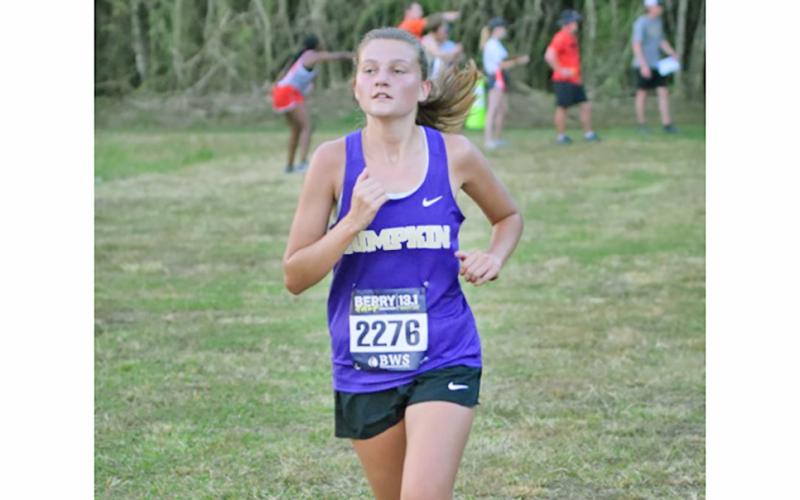 Lumpkin’s Avery Shadburn works to stay ahead of the competition at the North Hall meet.
