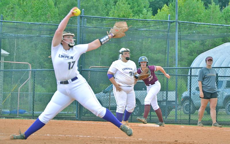 Lumpkin’s Natalie Shubert tosses a pitch with a Dawson runner on first base last week. The Tigers narrowly defeated the Lady Indians 2-0.