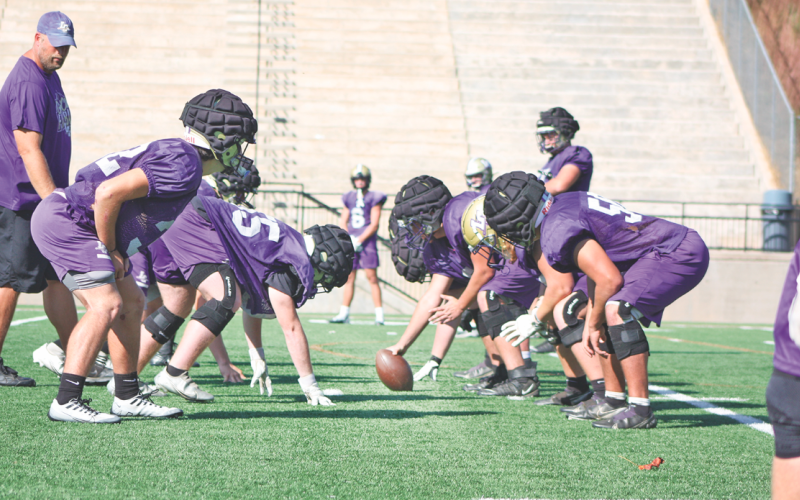 The varsity football team prepares for their game this Friday at White County.