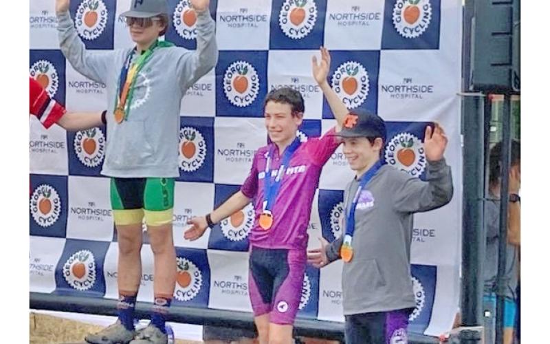 Lumpkin County eighth grader Mathieu Weber (center) finished third at the team’s recent race.
