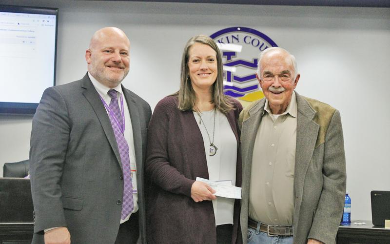 Claude Gilstrap (right) presented donations totaling $8,000 to Lumpkin County Schools Superintendent Dr. Rob Brown and Lead School Social Worker Joni McElwaney at the Board of Education’s November session.