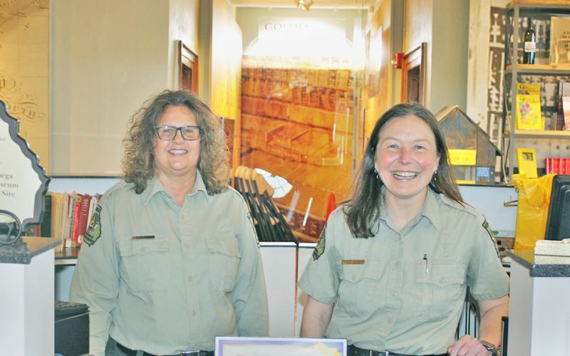 Tour Guide Charlotte Lindley (left) and Site Manager Heather Abercrombie are ready to greet guests at the historic Dahlonega Gold Museum.