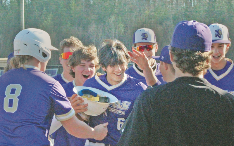 The Lumpkin County varsity baseball team celebrates Alejandro Narvaez’s home run against Towns County.