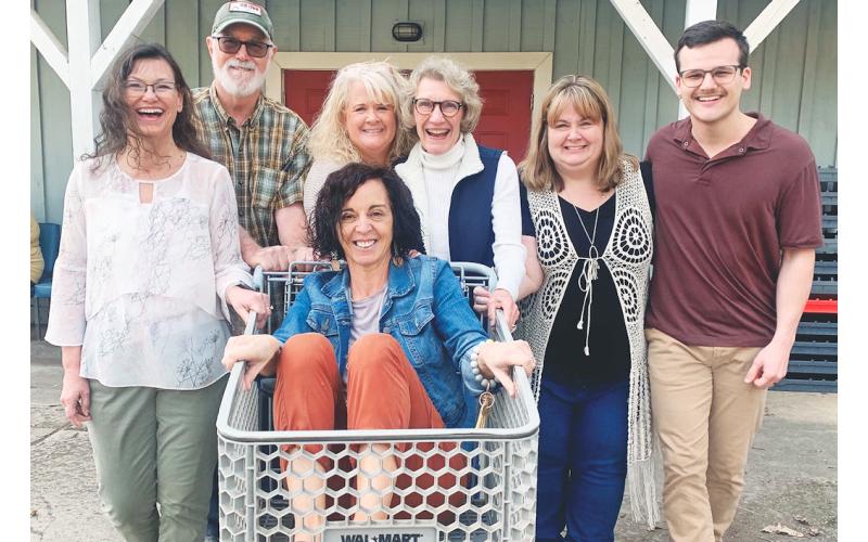 CHP staff members, from left, Debi Holloway, Lee Tidwell, Erin Cook, Barbara Day Miller, Melissa Line, Chandler Girton and Paula Payne (in the cart) are ready for a fun fundraiser. (Photo by Matt Aiken)