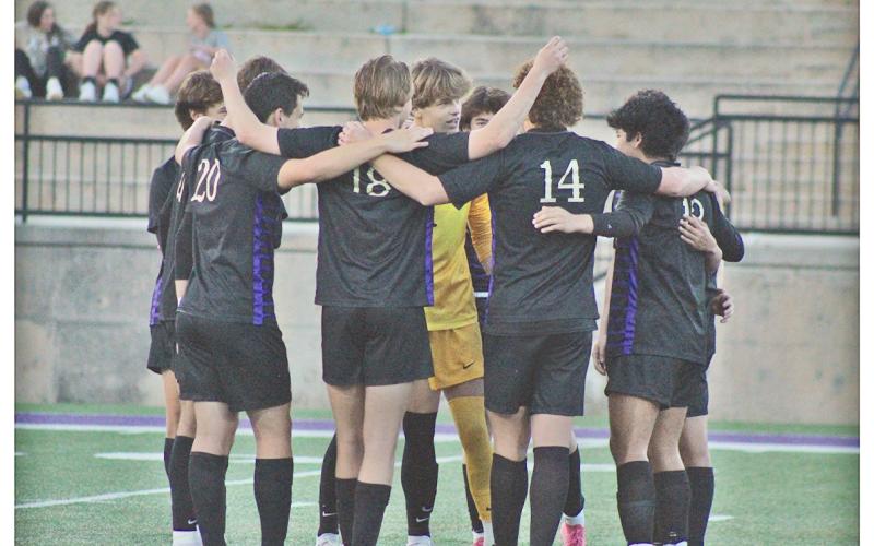 The Lumpkin County boys soccer team huddles up before their game against Wesleyan.