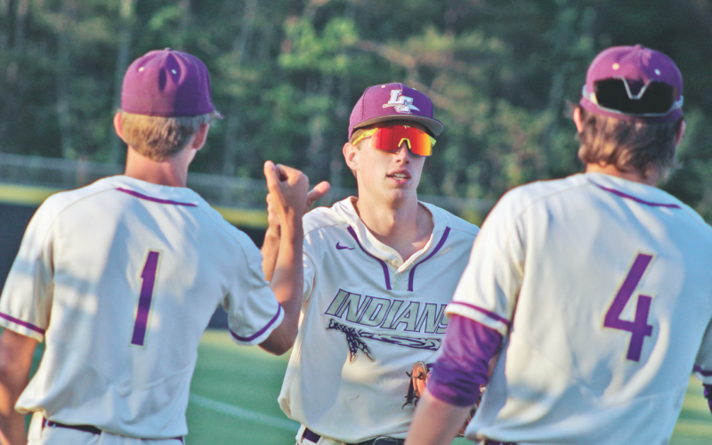 Lumpkin senior Landon Greene celebrates a diving catch during Lumpkin’s game versus Wesleyan.