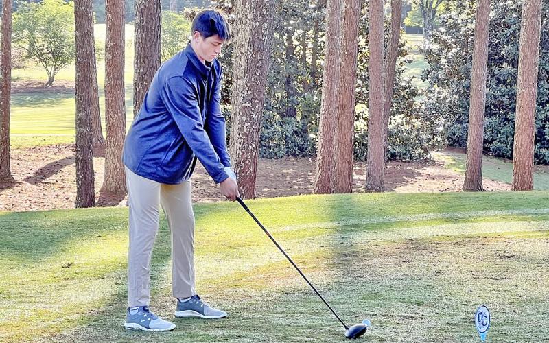 Lumpkin County’s Jac Chambers lines up his shot at the area meet at UGA Golf Course.