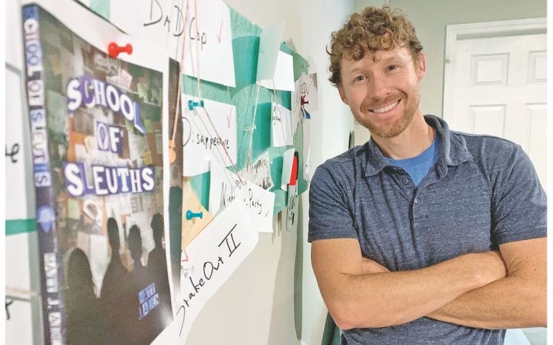 Executive Editor Matt Aiken has spent many hours in the basement writing School of Sleuths, which is soon to be his his first published novel. Much like the main characters in the book, Aiken kept track of the multiple mysterious plot points with a large tack-filled bulletin board deemed “The Crazy Board.”