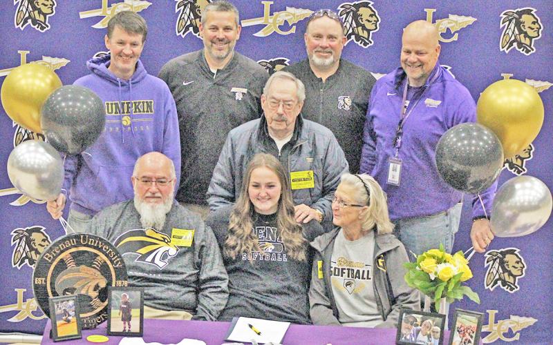 Lumpkin County senior Natalie Shubert celebrates her college signing along with her family and coaches.