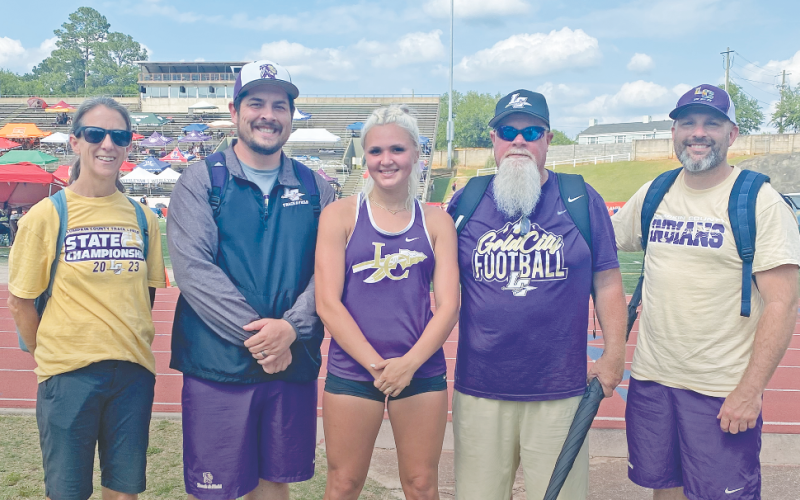 Assistant Coach Terri Hilchie, Head Coach William Mayfield, Kaylee Caldwell, Assistant Coach Stoney Lundsford, Assistant Coach Scott Mildenhall celebrate following the historic event.
