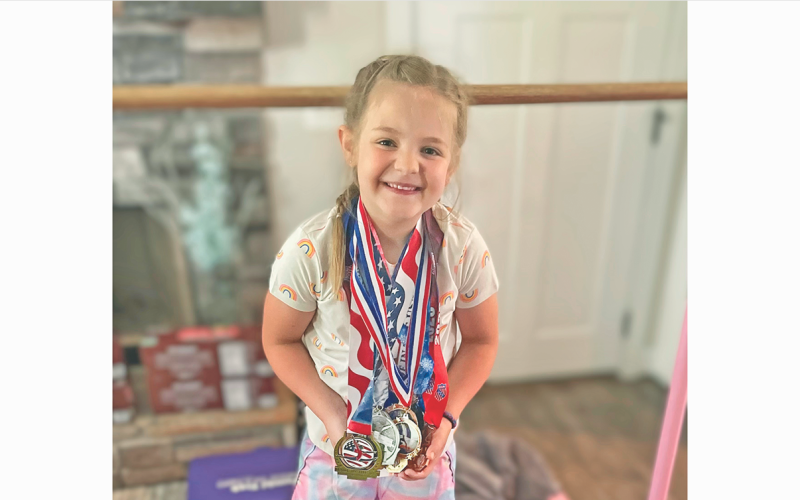 Lumpkin gymnast Jenna Watkins shows off the medals she earned at the State Championship meet.