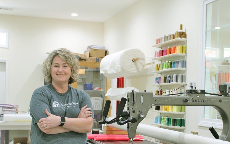 Shannon Caldwell shows off her automated Gammill longarm machine at The Common Thread.