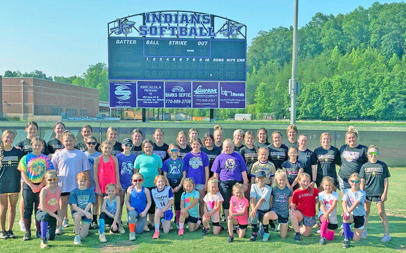 Future Lumpkin softball stars take a break from their summer camp workouts.