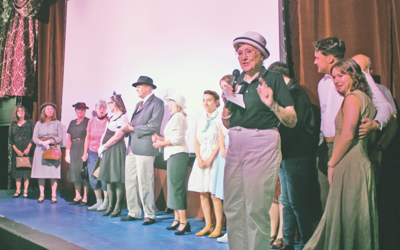Holly Theatre Chairman Emerita Ivana Pelnar-Zaiko explained the rules of the audience-judged 1940s costume contest prior to the start of the movie.