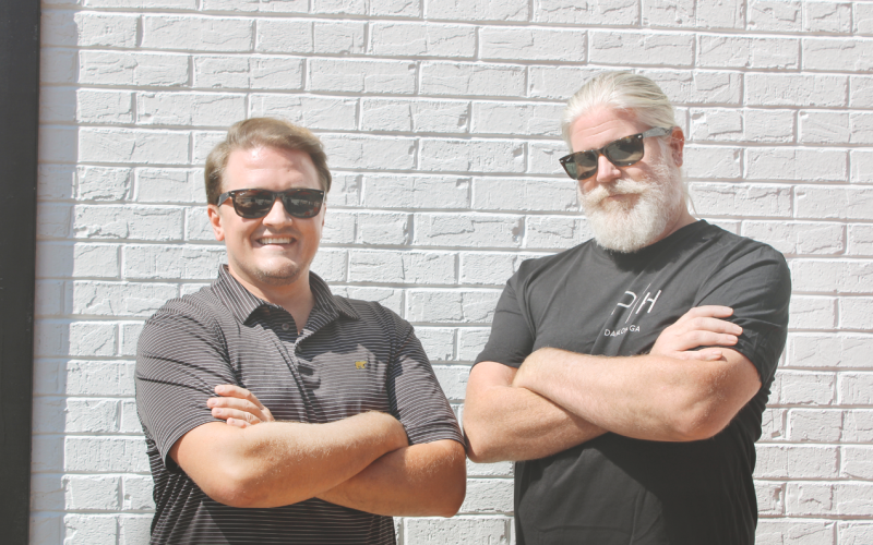 New restauranteurs Ryan Reagin, left, and Tracy Huggins take a quick break from their busy day on the outdoor patio of the new Public House Kitchen &amp; Cocktails.