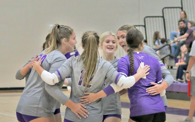 The Lady Indians celebrate a winning point in one of their games this week.