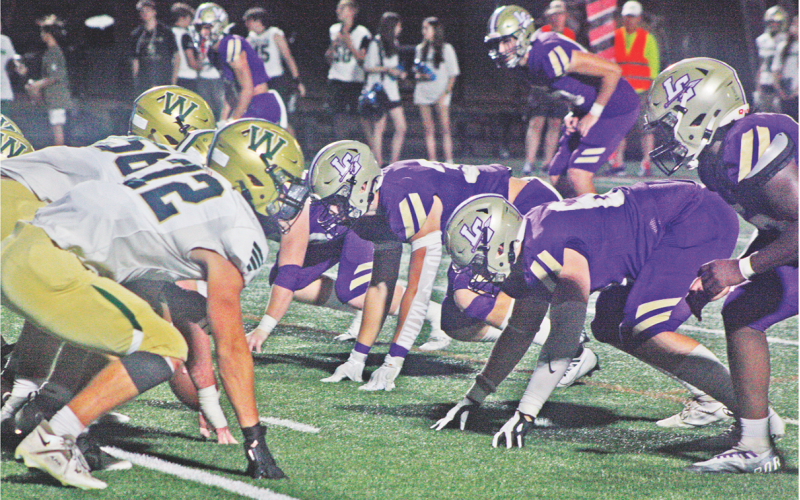 The Lumpkin defensive line squares off with the Wesleyan Wolves in last week’s game as the Indians came away with a 30-21 victory.