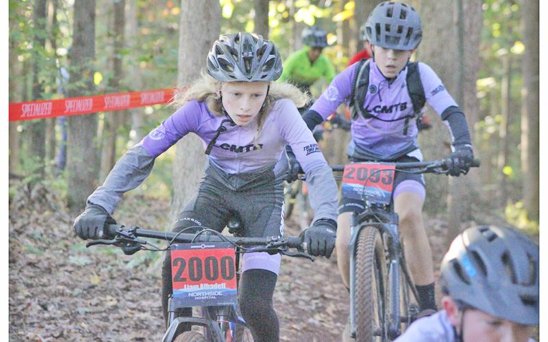 Liam Alhadeff races through the course on his way to a first place finish.