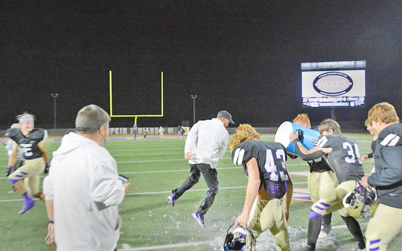 Head Coach Heath Webb gets a celebratory Gatorade bath after Lumpkin County’s victory over Gordon Lee on Friday night.