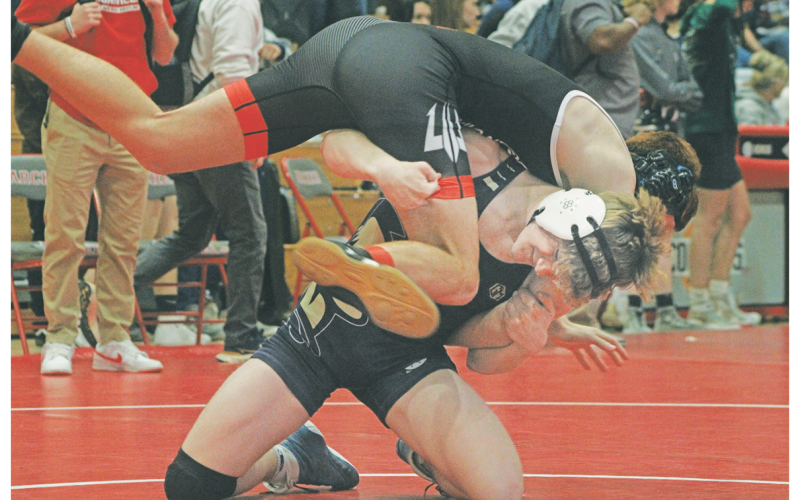 Lumpkin County wrestler Nathan Nielsen lands a fireman carry takedown on his opponent.