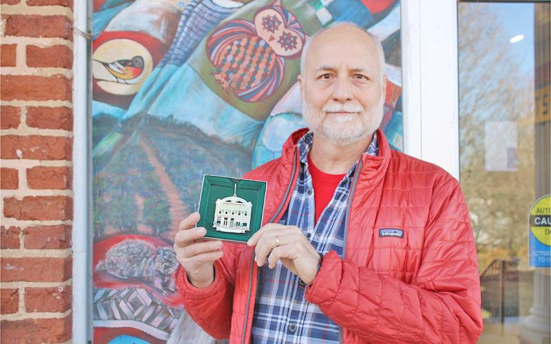Dr. Jon Melhferber displays the 2023 Christmas In Dahlonega collector’s ornament he helped design.