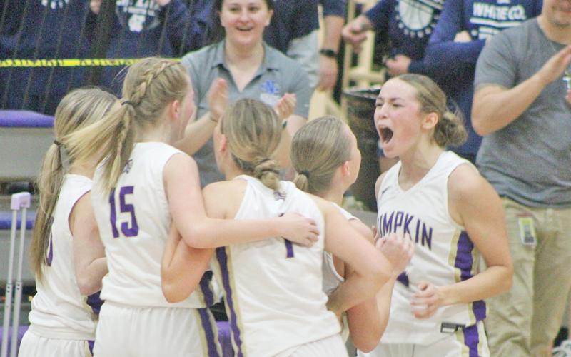 Lumpkin senior Averie Jones (right) and her teammates celebrate the big win over the Warriors.