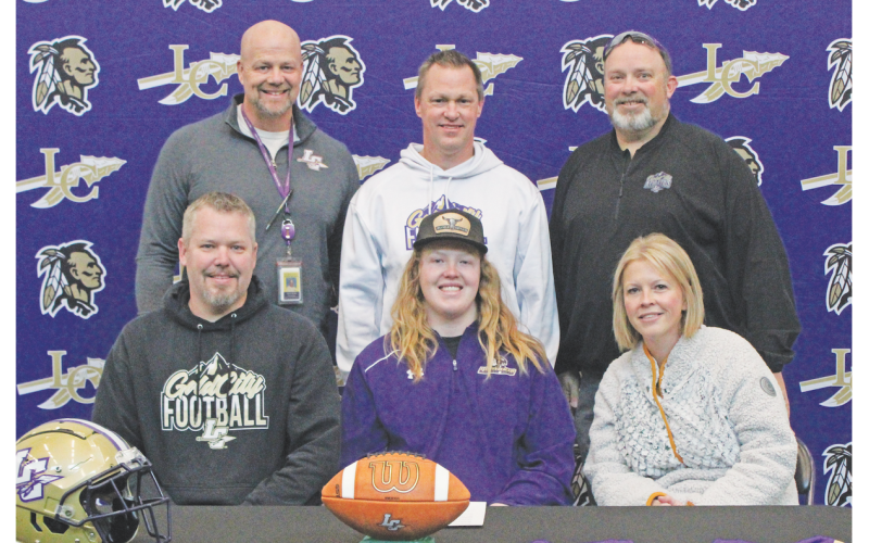 Pictured (front row, from left) are Adam Scott, Cooper Scott and Megan Scott. Back row are Principal Billy Kirk, Head Coach Heath Webb and Athletics Director Steve Horton.