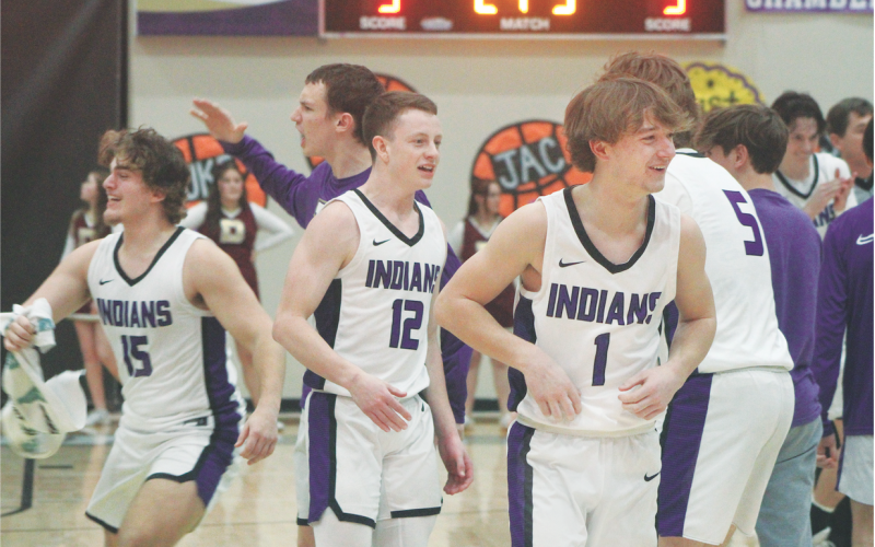 Teammates, from left, Colton Hamm, Stephen Sherrill and Luke Evans celebrate an Indians victory after a recent Lumpkin County game.