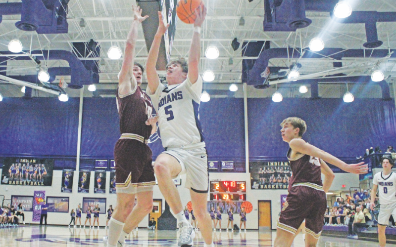 TJ Gaddis lands a layup during the teams game against Dawson County.