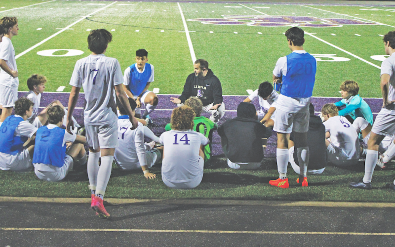 Head Coach Brent Howell rallies his Lumpkin County team during halftime.
