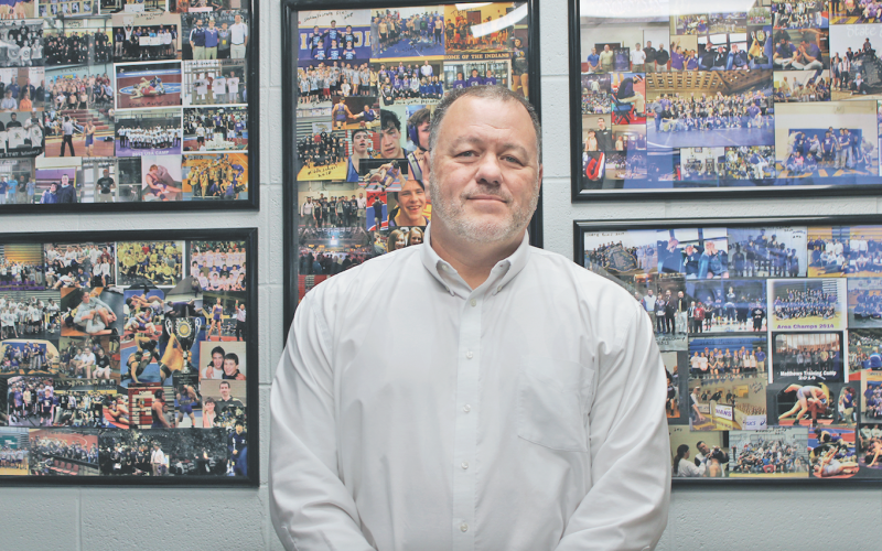 Brian Matthews has collages of photos from 15 years of coaching football hanging on the wall in his middle school office.