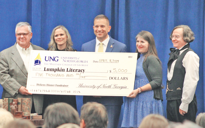 Pictured, from left, Lumpkin Literacy Chair Emeritus Geoffrey Kridel, UNG First Lady Jessica Shannon, UNG President Michael Shannon, Lumpkin Literacy Chair Caroline Smith, and Dr. Brian Corrigan were all smiles as UNG presented a check for $5,000 to Lumpkin Literacy. (Photo by Keith Murden / The Nugget)