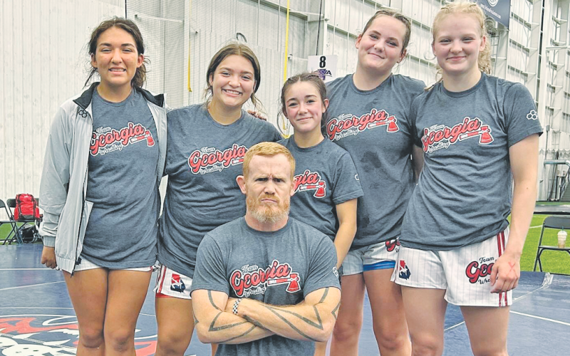 Mattie Mendoza, Natalie Mendoza, Cadence Grulla, Faith Jones, Greta Garbuzovas and Team Alpha Coach Micah Goss represented Lumpkin on the National stage.