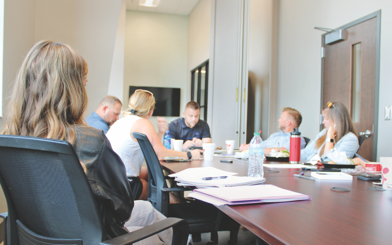 Parks &amp; Rec Manager Tim Towe (center) reviews summer sports registration with members of the Citizens Advisory Committee at Pinetree Recreation Center.