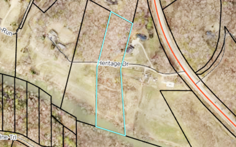 An image from the qPublic.net website shows parcel 064 065, where the new kayak takeout will be located. Heritage Drive cuts through the center of the property, with Chestatee River access visible on the south end.