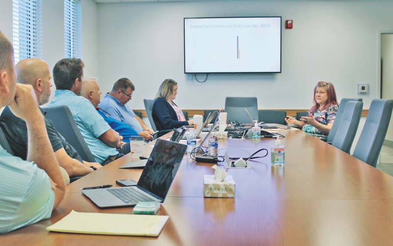 Lumpkin County Department of Family and Children Services Director April Arnold (right) explains her 2025 budget priorities to the Board of Commissioners during a recent special work session.