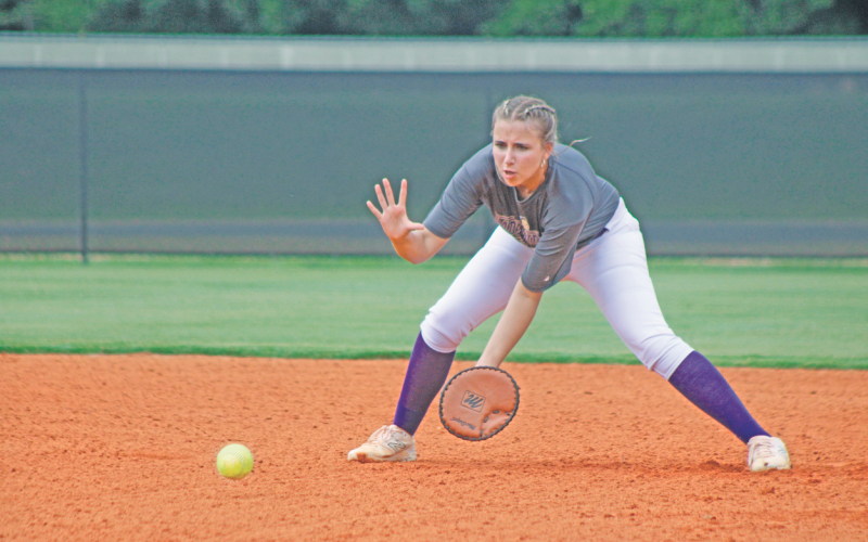 Julianna York prepares to make a defensive stop during the Lumpkin County High School softball team’s practice.