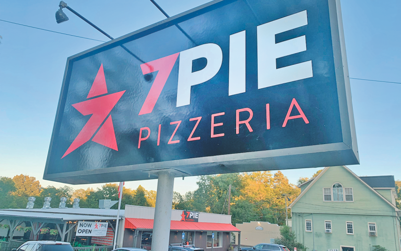 The pole-mounted sign at 7 Pie Pizzeria will remain in place after narrowly receiving approval by the Dahlonega City Council.