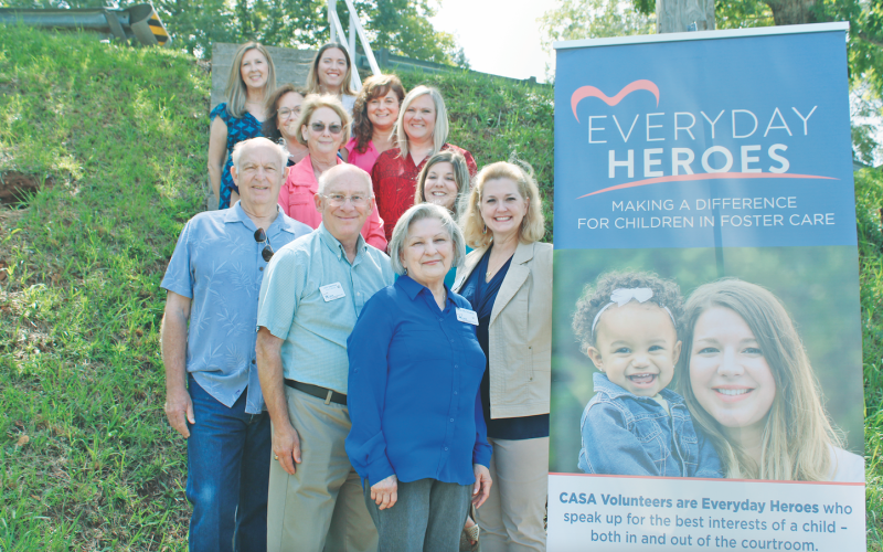 Pictured from CASA are Georgia Volunteer of the Year Pam McCampbell (front), Board Member John Seymour and Executive Director Della Lago (second row), Board Chair Ben Wallace and Advocate Supervisor Katie Dunlap (third row), Board Member Karen Powell and Administrative Assistant Debbie Schofield (fourth row), Outreach Coordinator Fran Parks and Georgia Executive Director Jen King (fifth row) and Georgia Program Operations Director Deidre Hollands and Georgia Marketing Director Rachelle Mosley (top row).