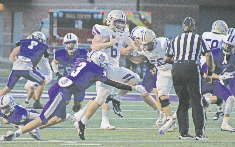 Lumpkin County’s Nolan Matthews fights his way through the Cherokee Bluff defensive line in last week’s game.